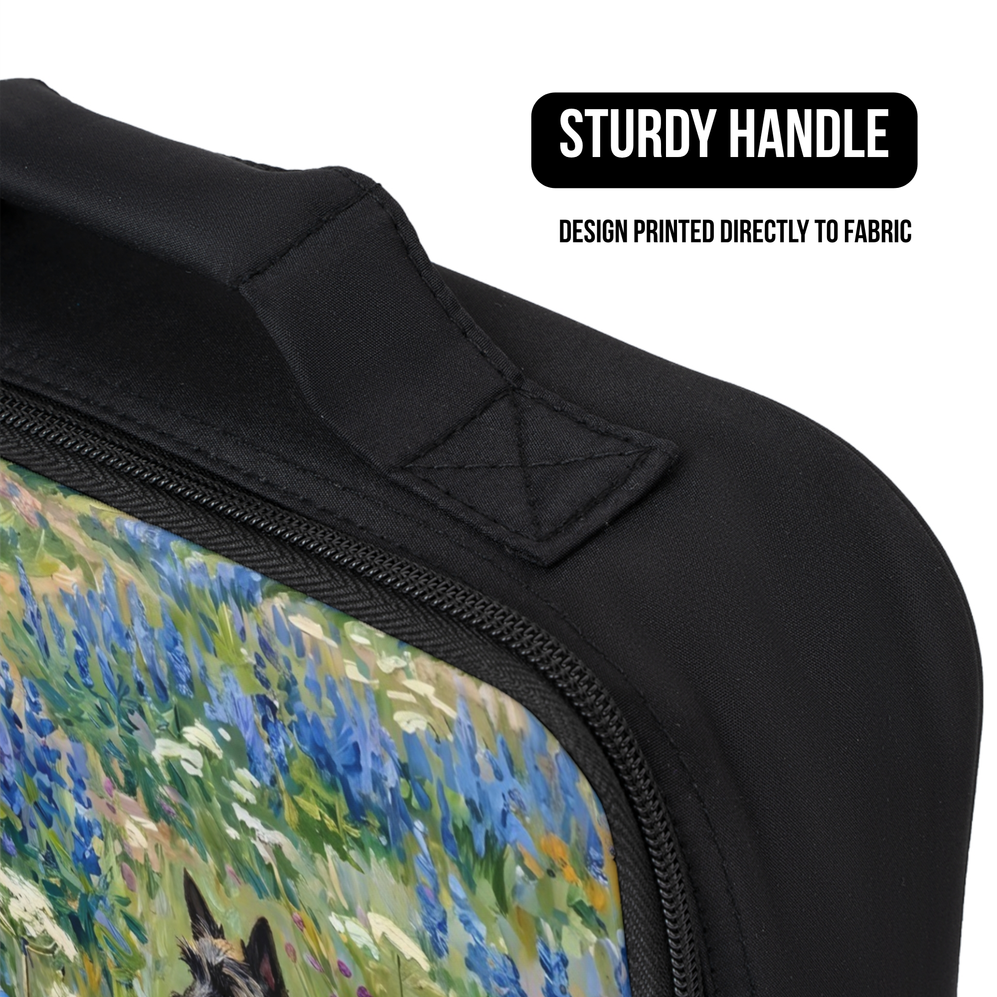 Black bag with a printed design of a landscape, featuring a sturdy handle.