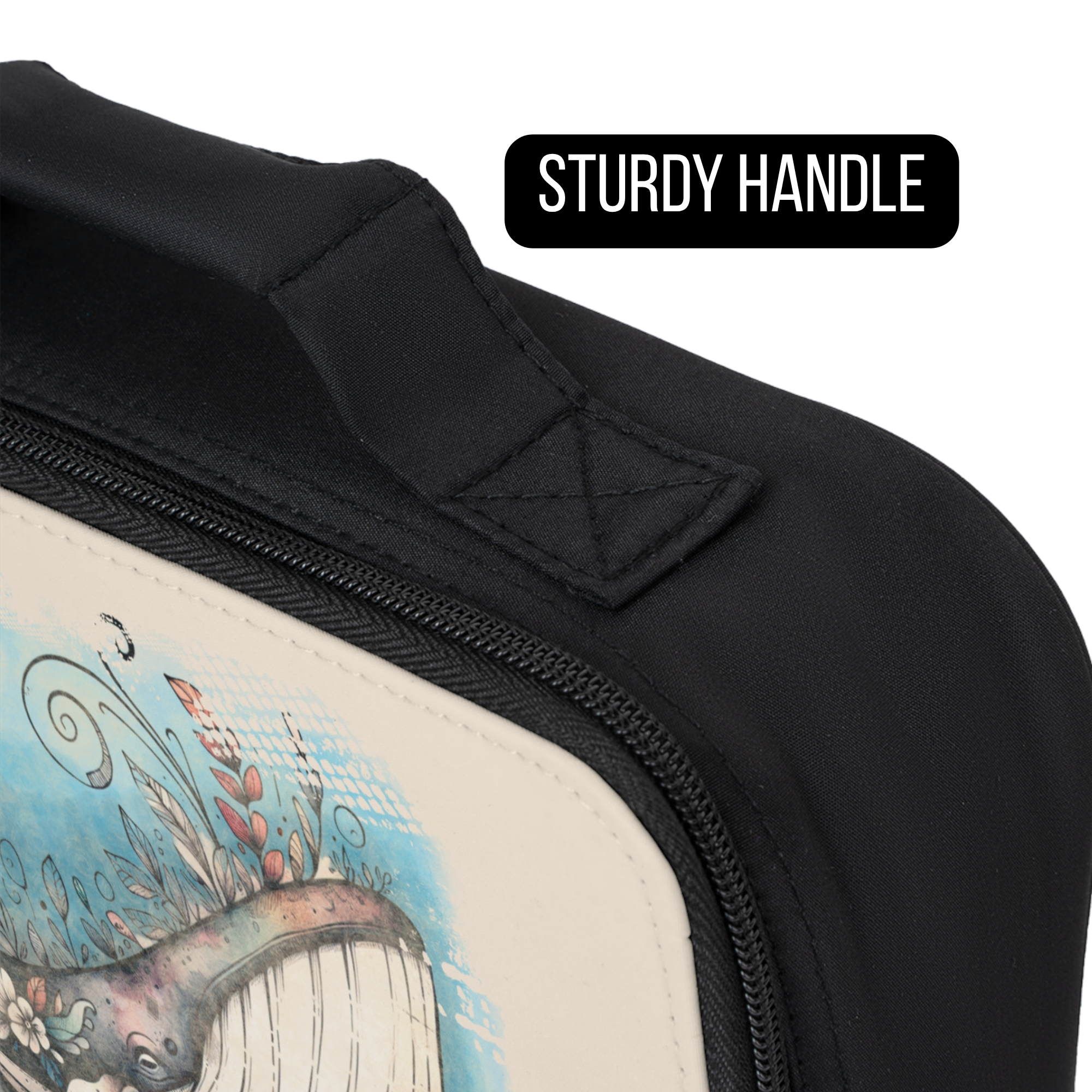 Close-up of a black bag with a sturdy handle and a design of a whale and ocean scene.