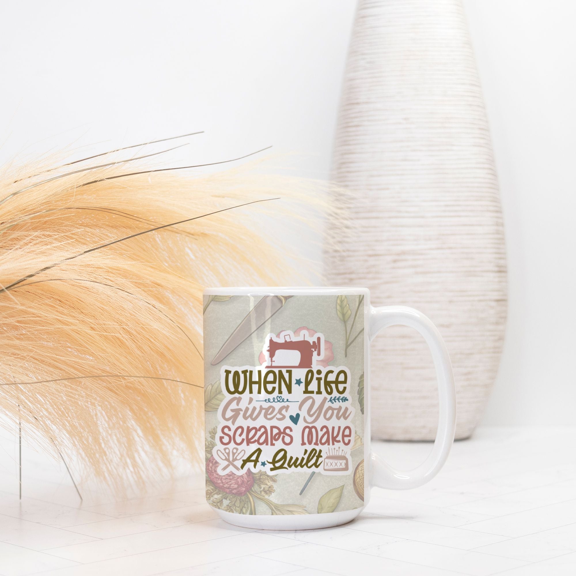 Mug with sewing-themed design and text on a white surface with decorative elements.