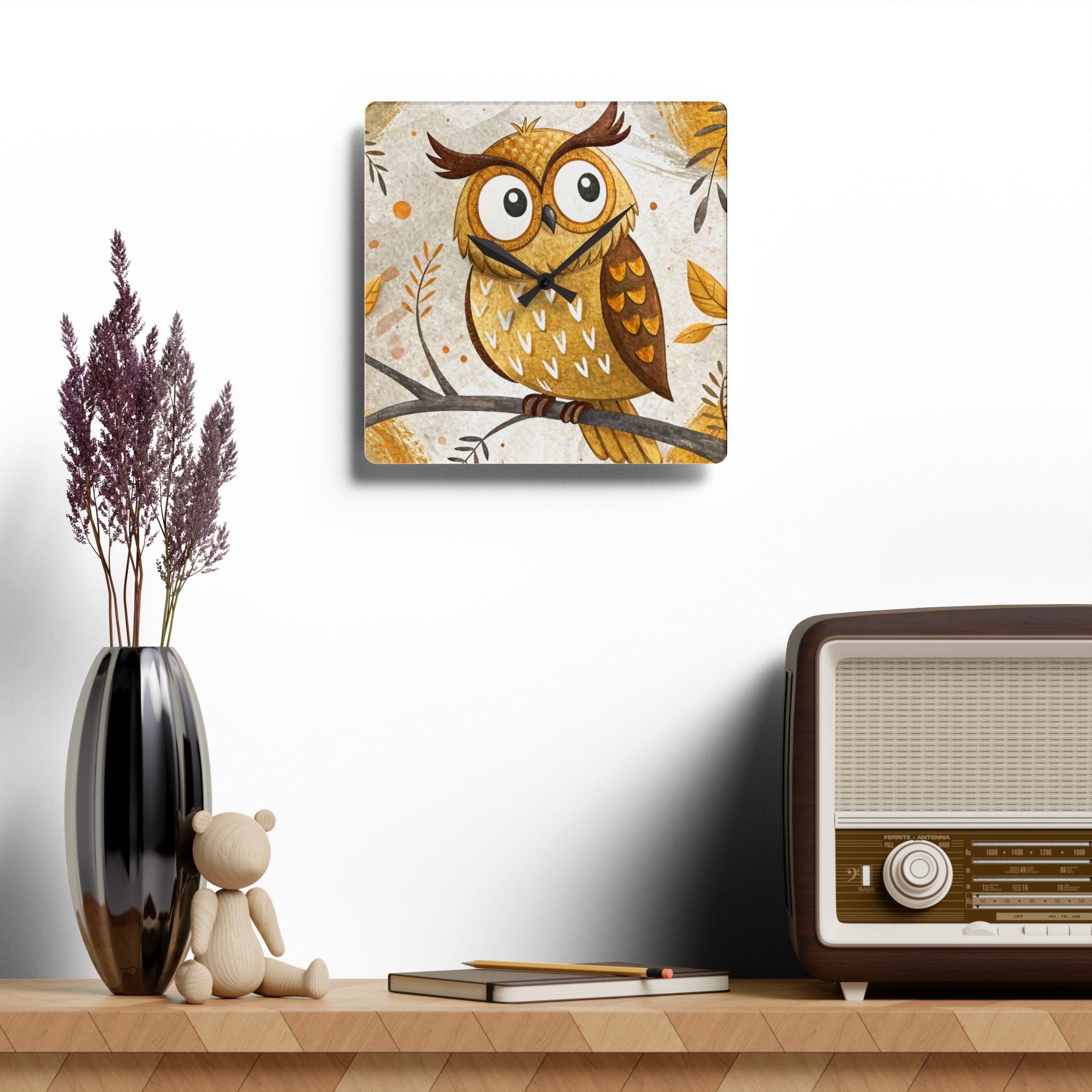 Decorative owl clock on a shelf with a vase, teddy bear, and vintage radio.