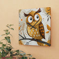 Decorative owl clock on a beige wall with a plant in the foreground