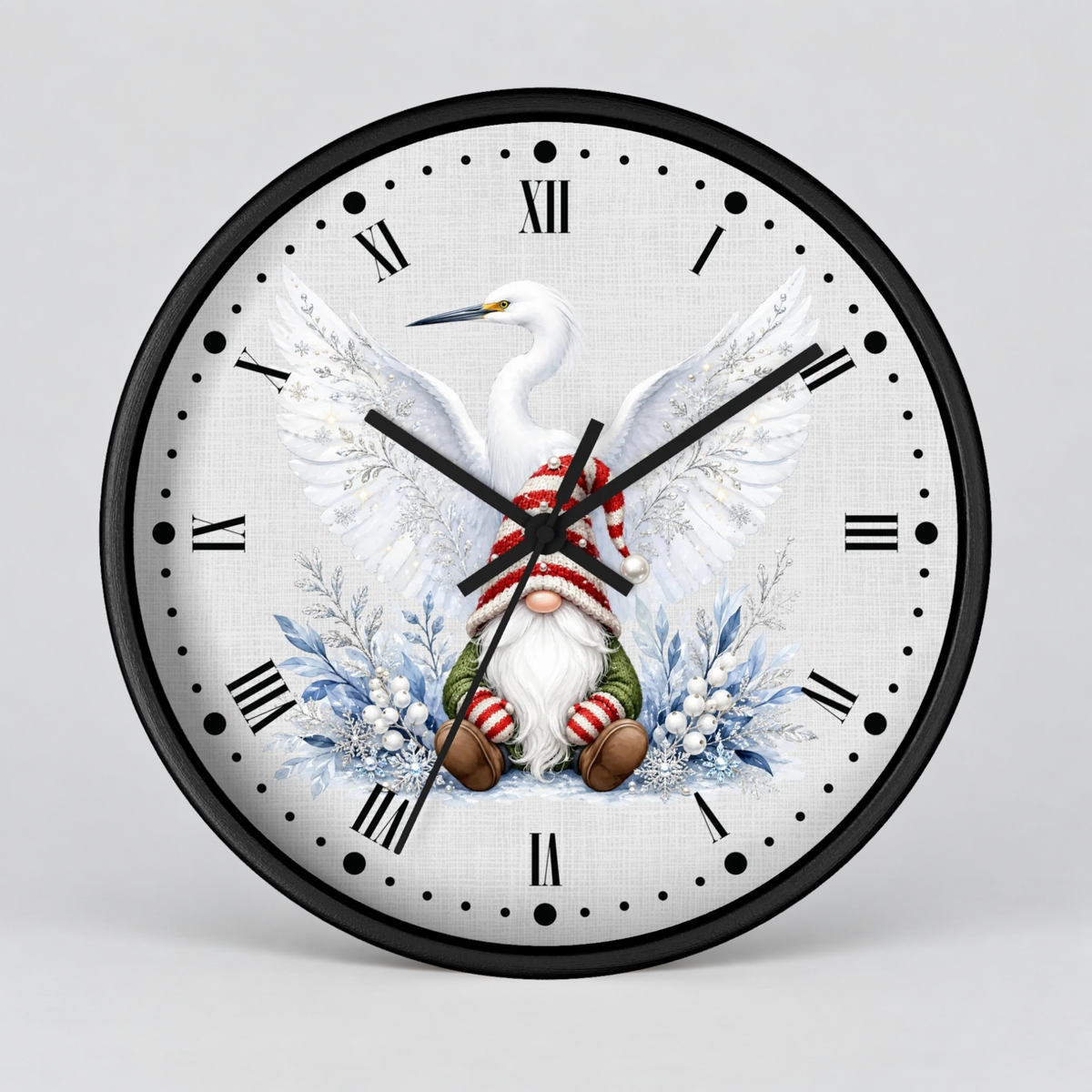 A round wall clock with a black frame and a white clock face featuring a festive illustration of a white heron and a Christmas gnome surrounded by blue winter foliage.