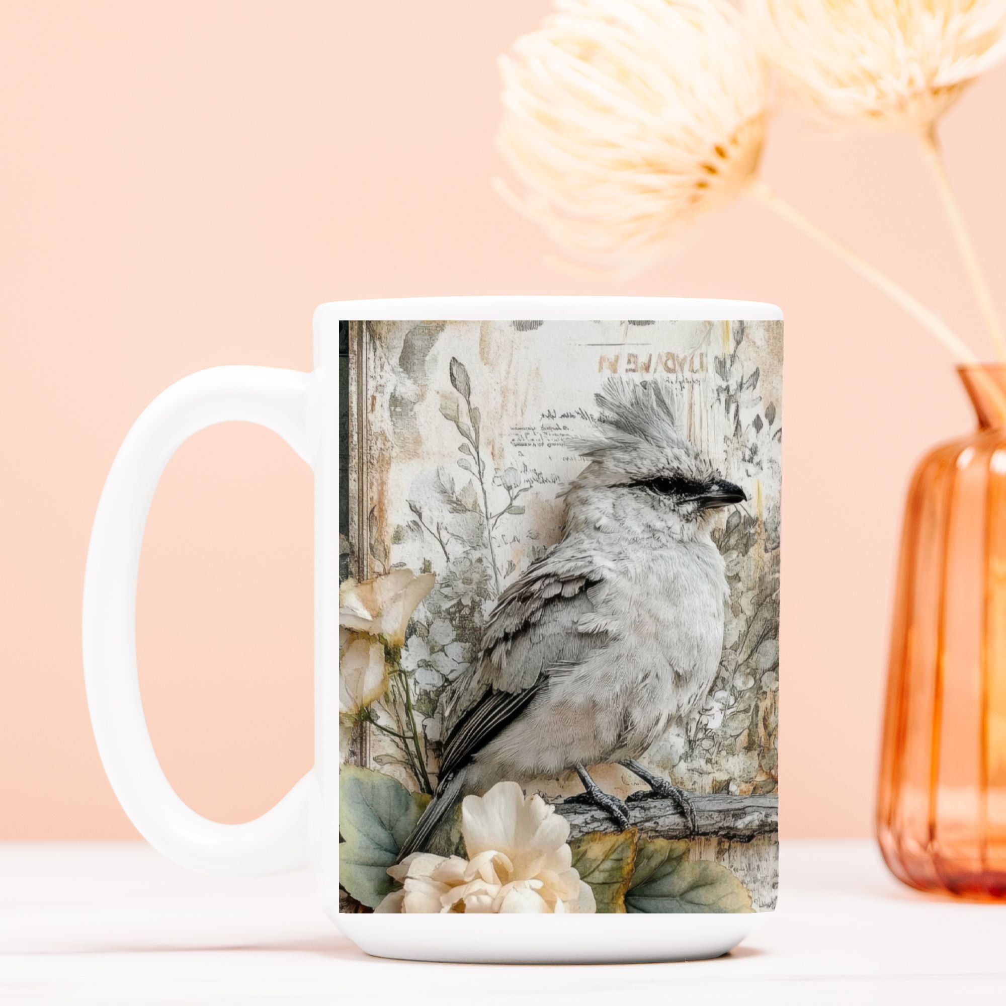 White mug with a bird design on a peach background