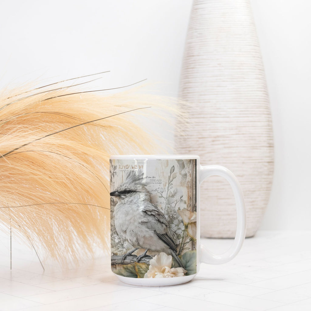 Mug with a bird design on a white surface with decorative elements