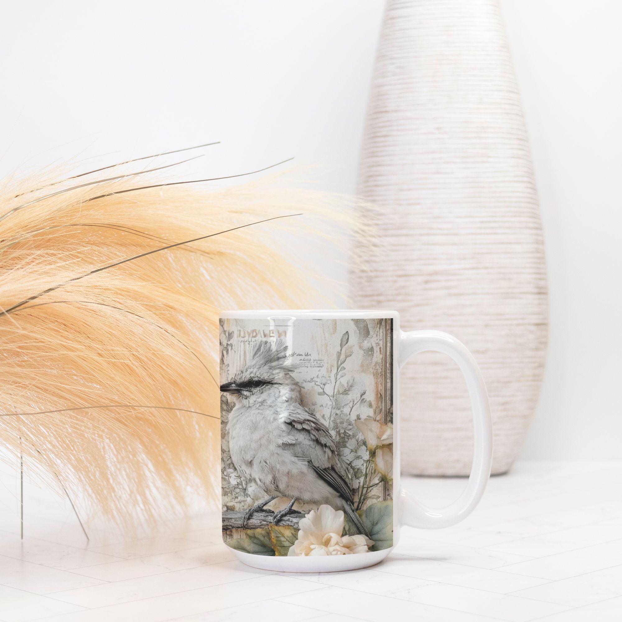 Mug with a bird design on a white surface with decorative elements