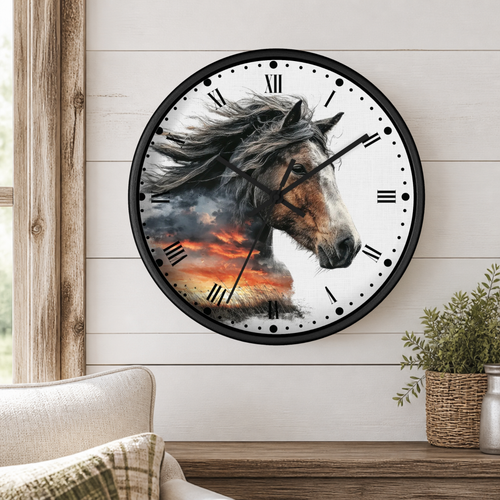 A round wall clock with a black frame and a printed horse head design over a dramatic sunset sky, mounted on a white wood-paneled wall above a wooden shelf with a plant and part of a chair visible.