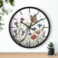 Round black decorative wall clock with floral and butterfly design on a white background