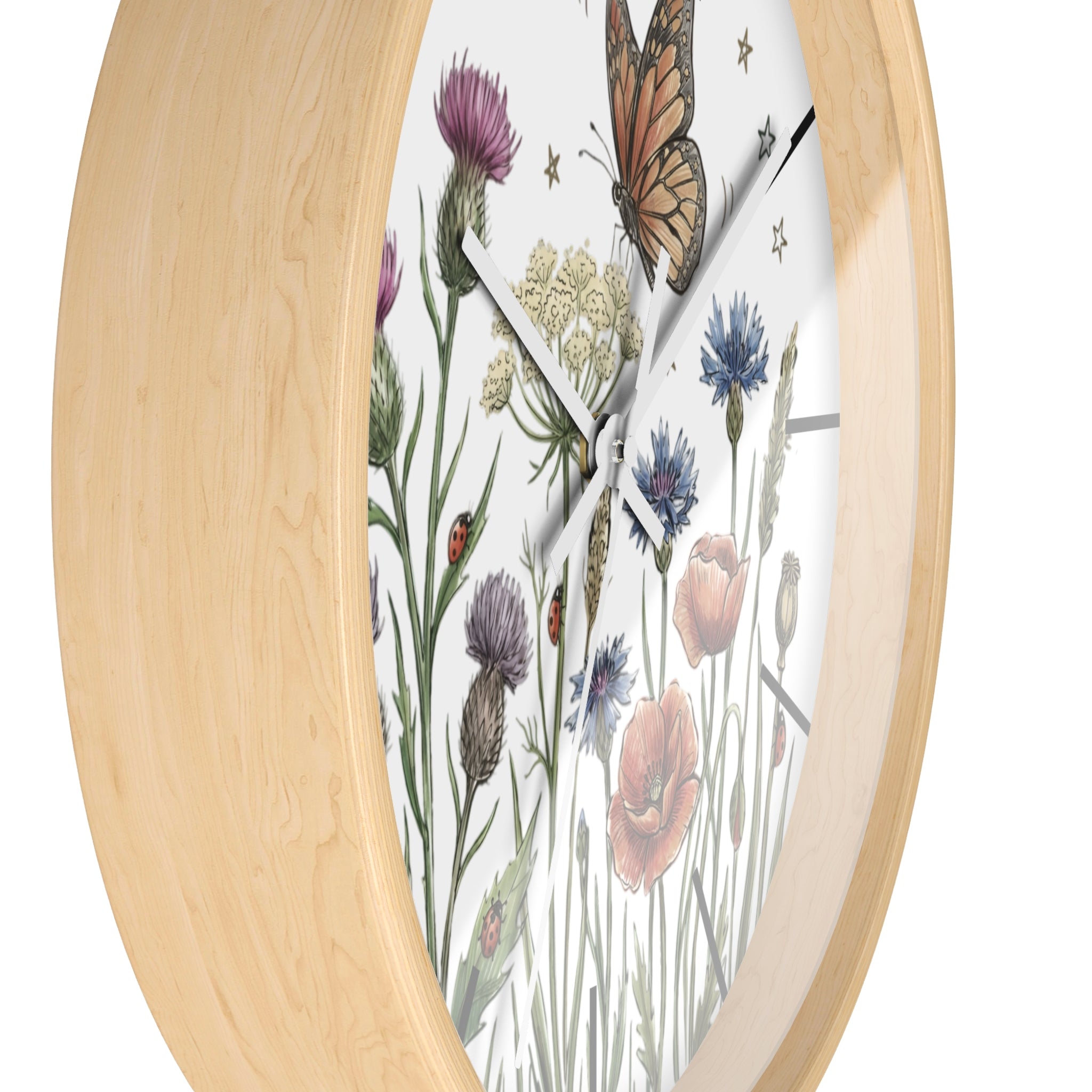 Side view of a round wooden wall clock with floral and butterfly design on a white background