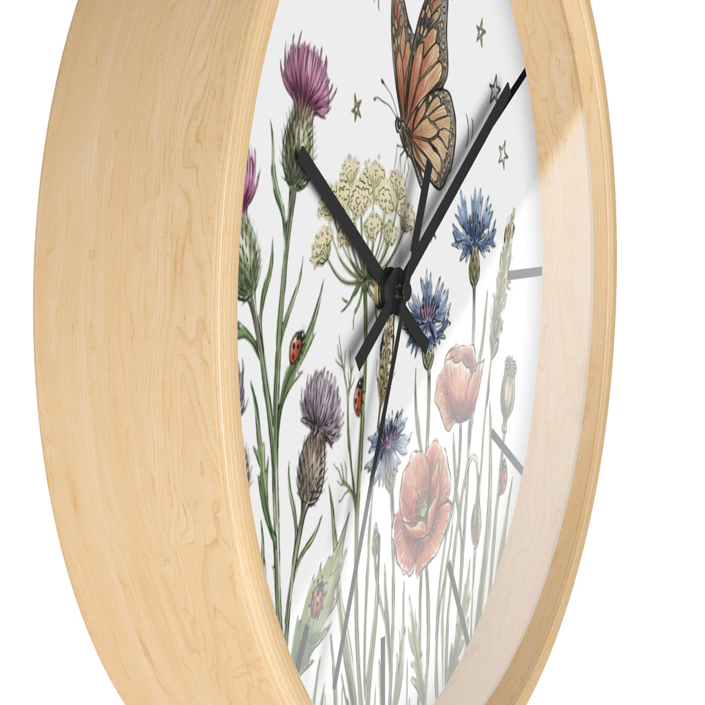 Side view of a wooden wall clock with floral and butterfly design on a white background
