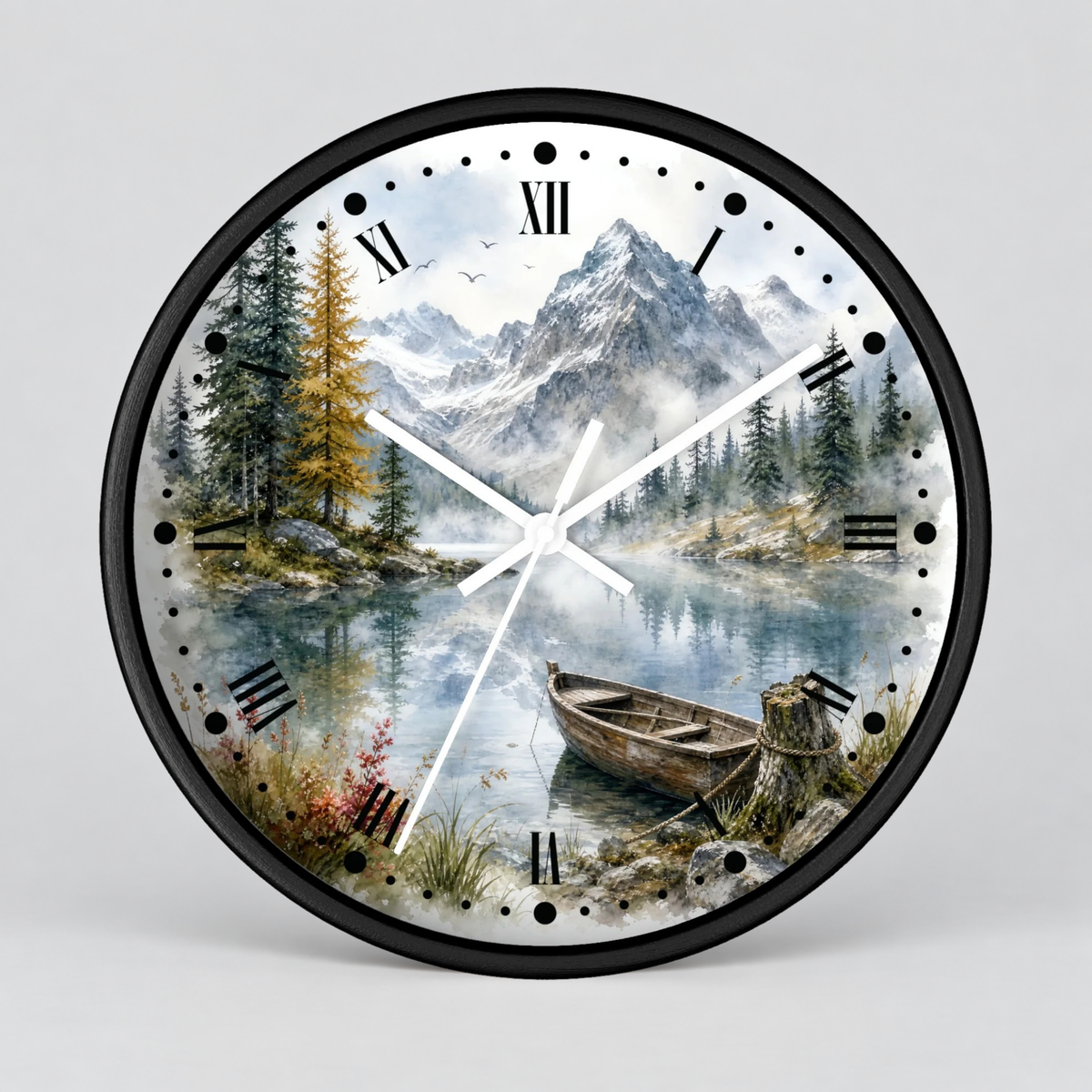 A round wall clock with a black frame and a scenic landscape print featuring mountains, pine trees, a calm lake, and a wooden boat. The clock face uses black Roman numerals and white hands, shown against a light gray background.