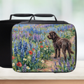 Black lunch bag with a dog and floral design on a white background