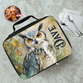 Lunch bag with owl design and 'DAVE' text on a cafeteria table with a drink and utensils.