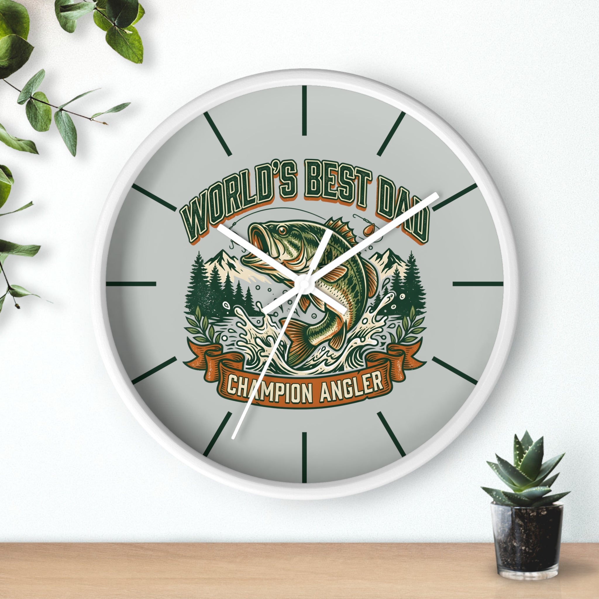 Round white wall clock with matching white hands and fishing design and text 'World's Best Dad, Champion Angler' on a light background.