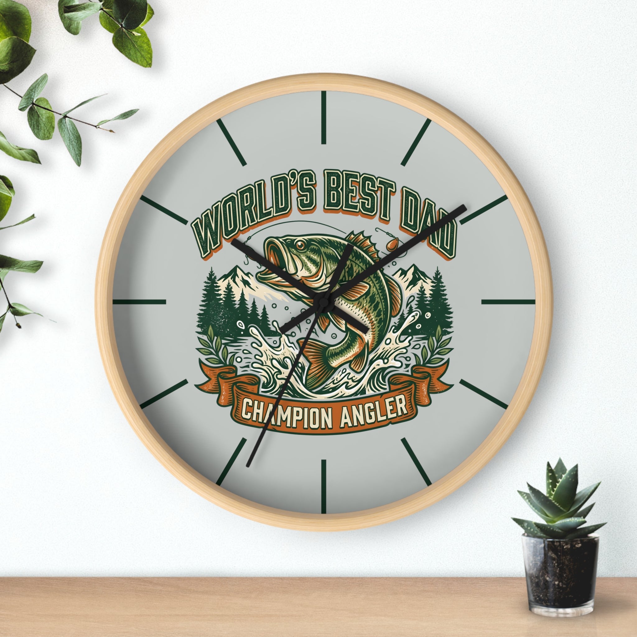 Round natural wood wall clock with black hands and  fishing design and text 'World's Best Dad, Champion Angler' on a light background.