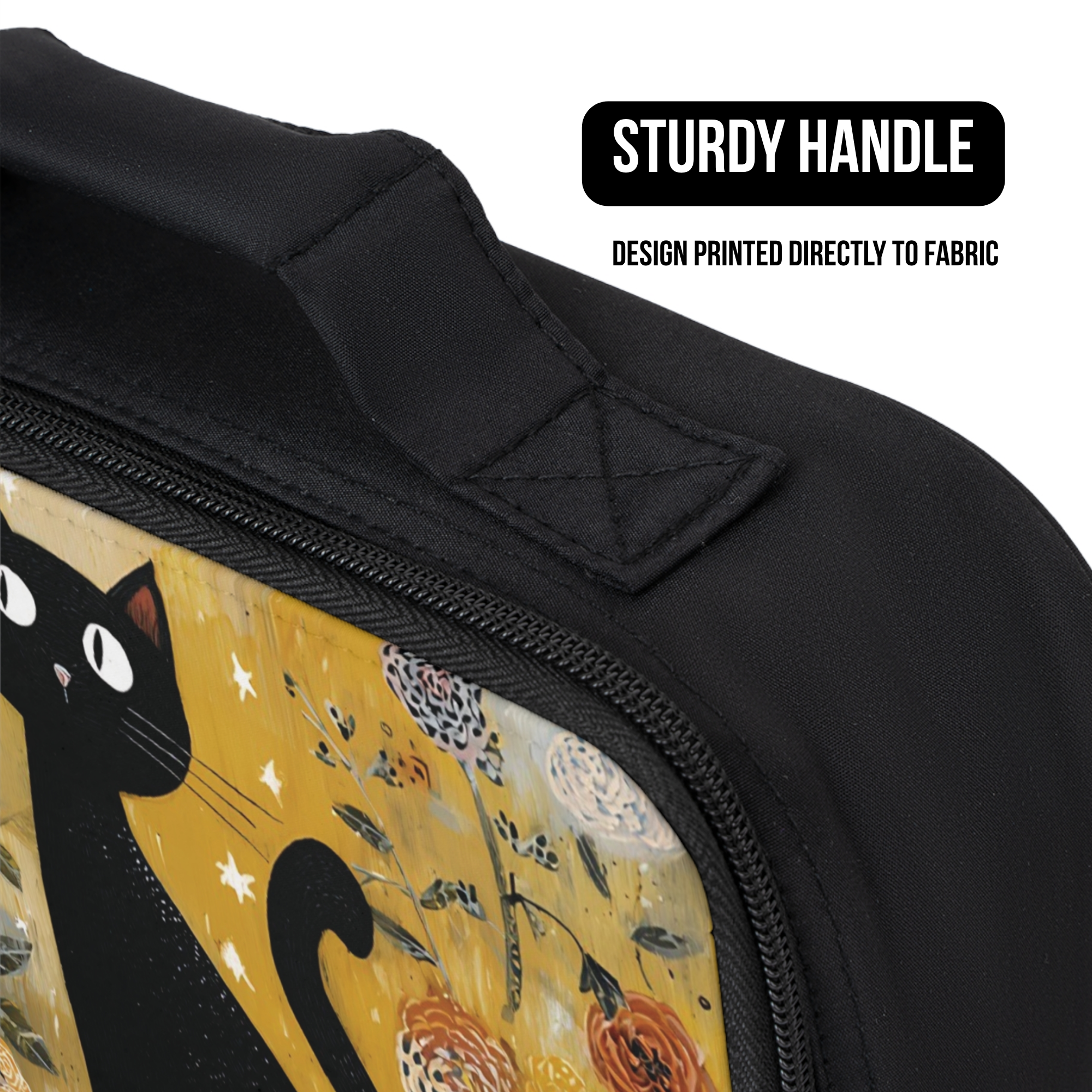 Black lunch bag with a cat design and sturdy handle on a white background