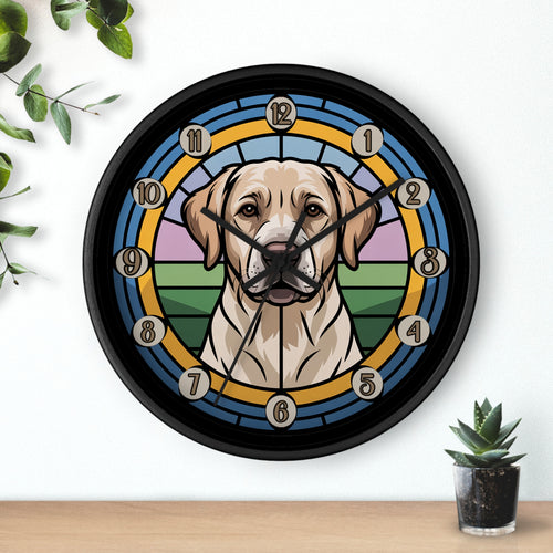 Round black wall clock with a Labrador Retriever dog illustration on a white wall with plants.
