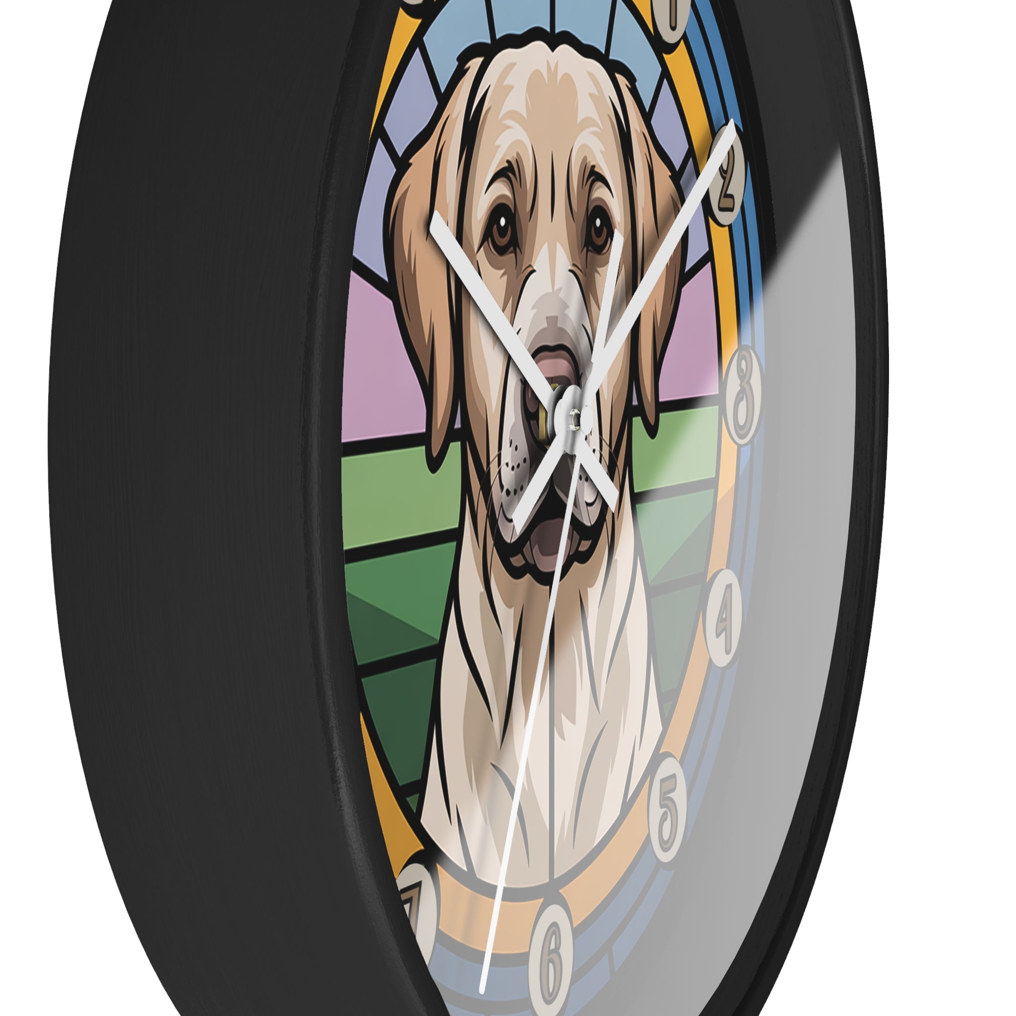 Side view of a round black wall clock with white hands and  a golden lab dog's face design in the center, resembling stained glass