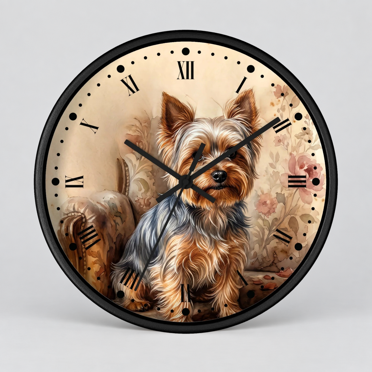 Round wall clock with a black frame and a printed illustration of a Yorkshire Terrier dog on the face, with black Roman numerals and hands, shown against a light gray background.