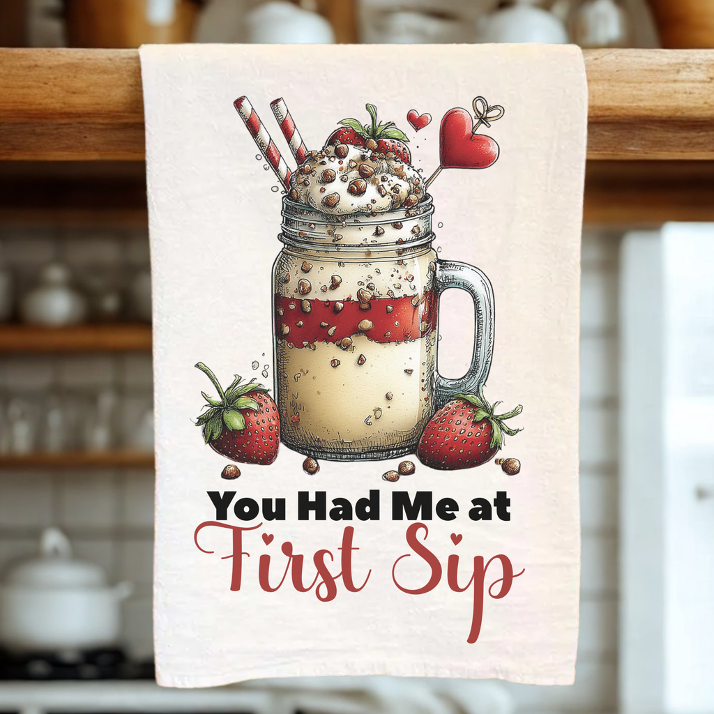 Kitchen towel with a mason jar design and text 'You Had Me at First Sip' in a kitchen setting.