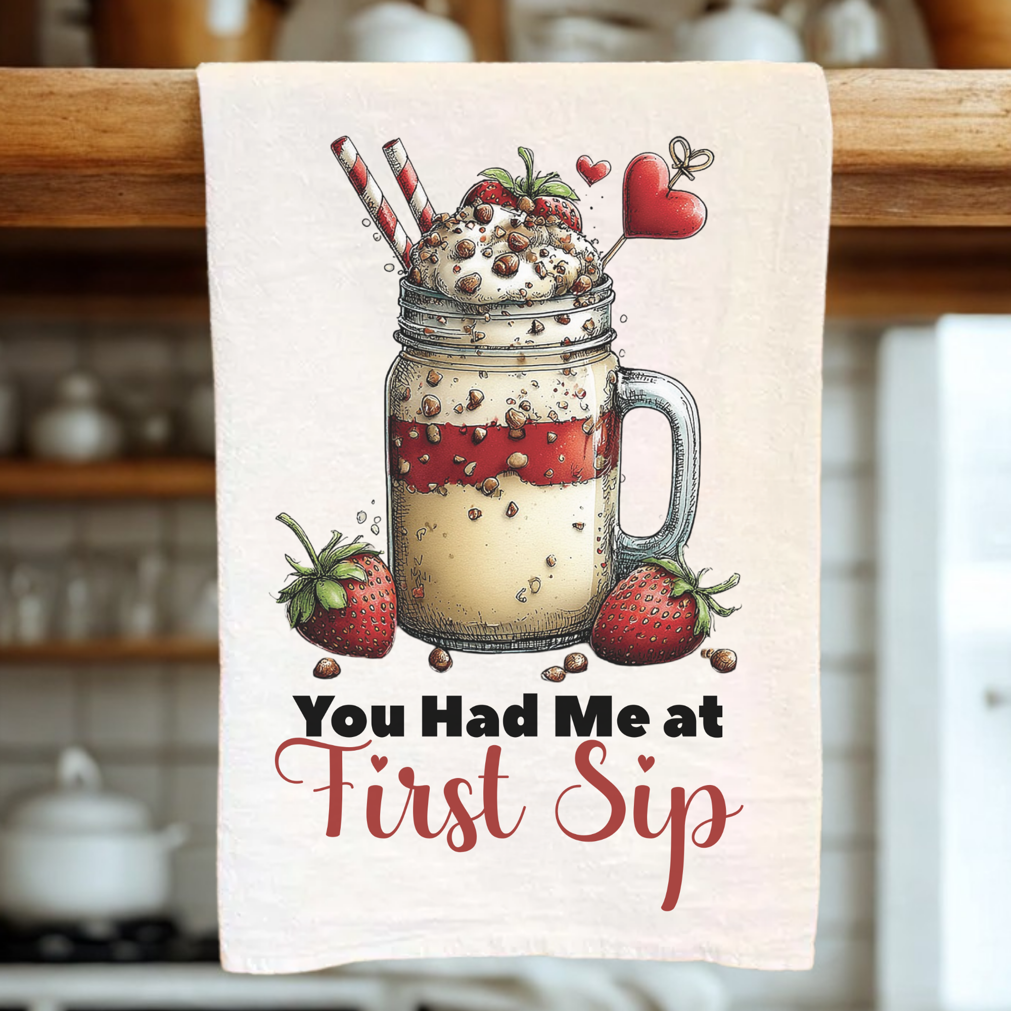 Kitchen towel with a mason jar design and text 'You Had Me at First Sip' in a kitchen setting.