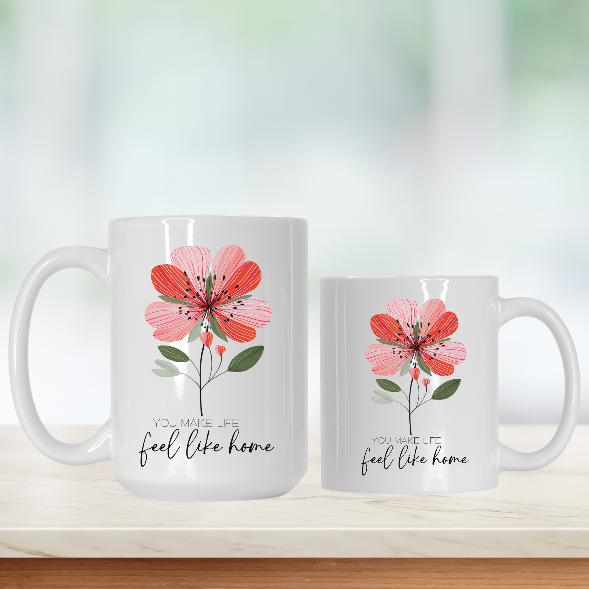 11oz & 15oz. white mugs with floral design and text on a blurred background