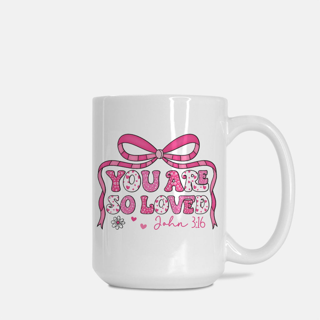 White mug with pink bow and text 'You are so loved John 3:16' on a white background