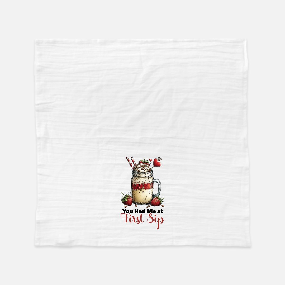 Tea towel with a milkshake graphic and text 'You Had Me At First Sip' on a white background