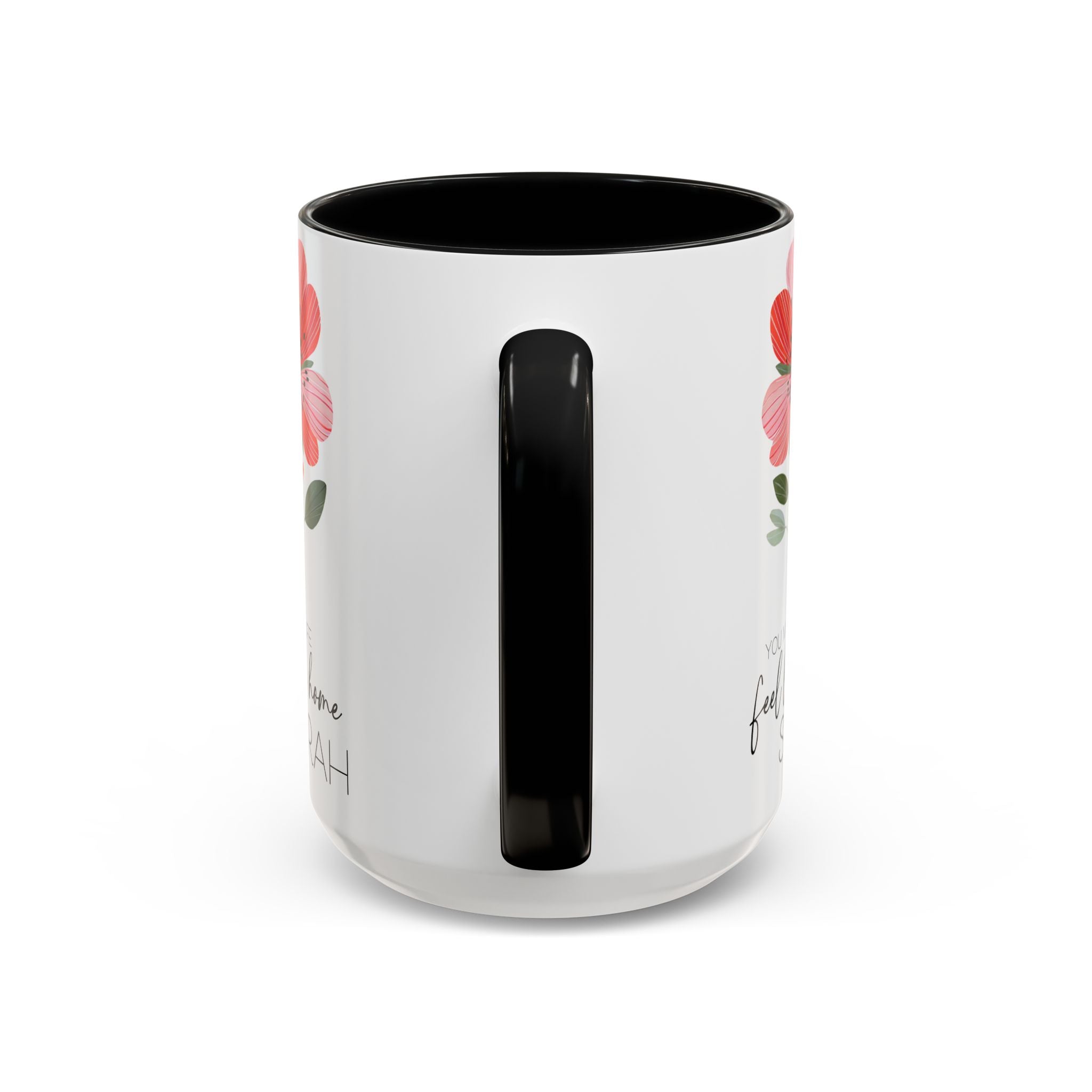 White mug with black handle and red floral design on a white background