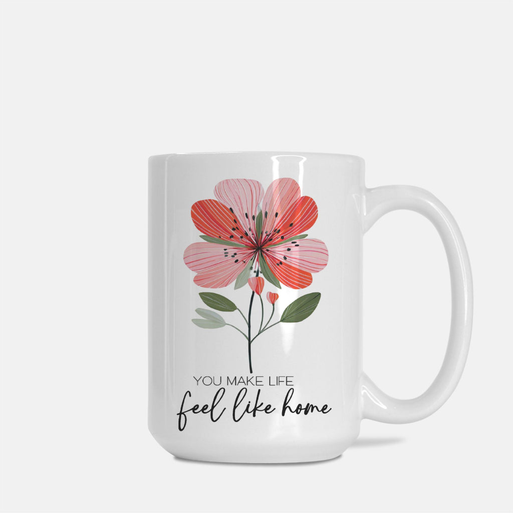 White 15oz. mug with a pink floral design and text on a white background
