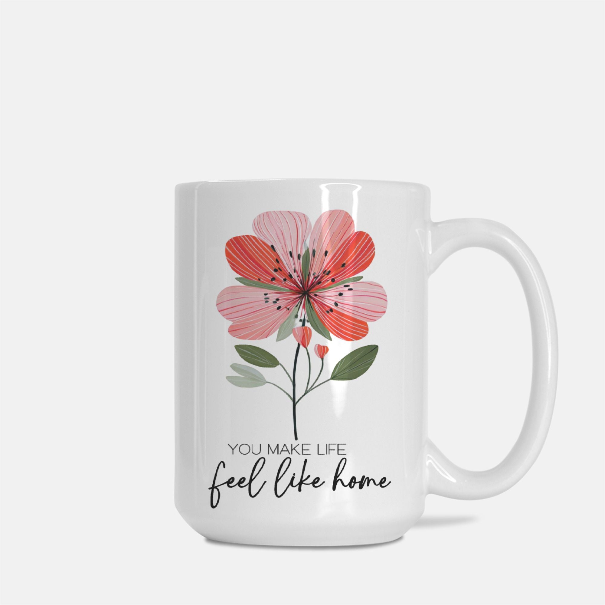 White 15oz. mug with a pink floral design and text on a white background