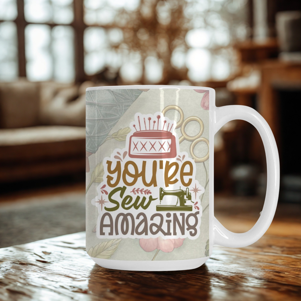 Mug with 'You're Sew Amazing' text on a wooden table in a cozy room.