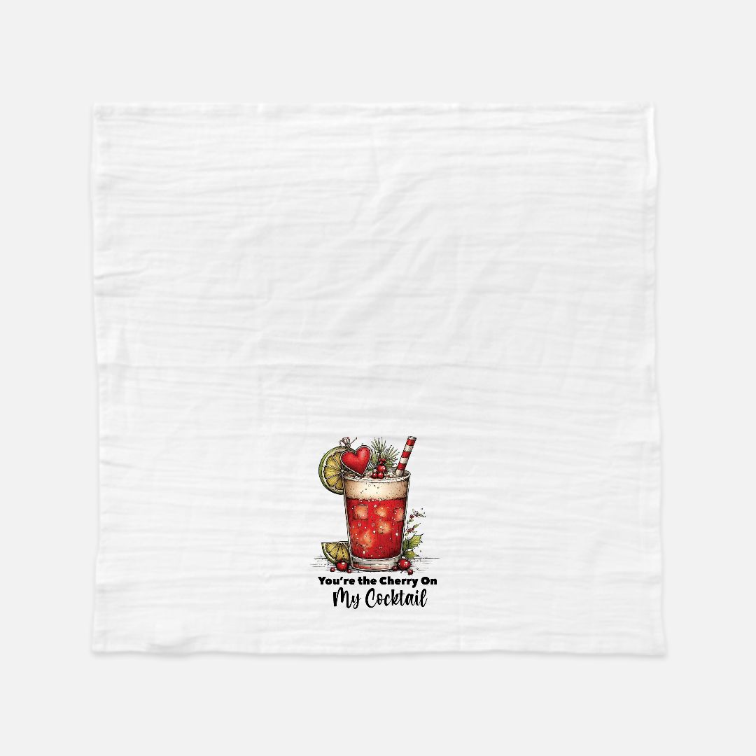 Tea towel with a cocktail graphic and text on a white background