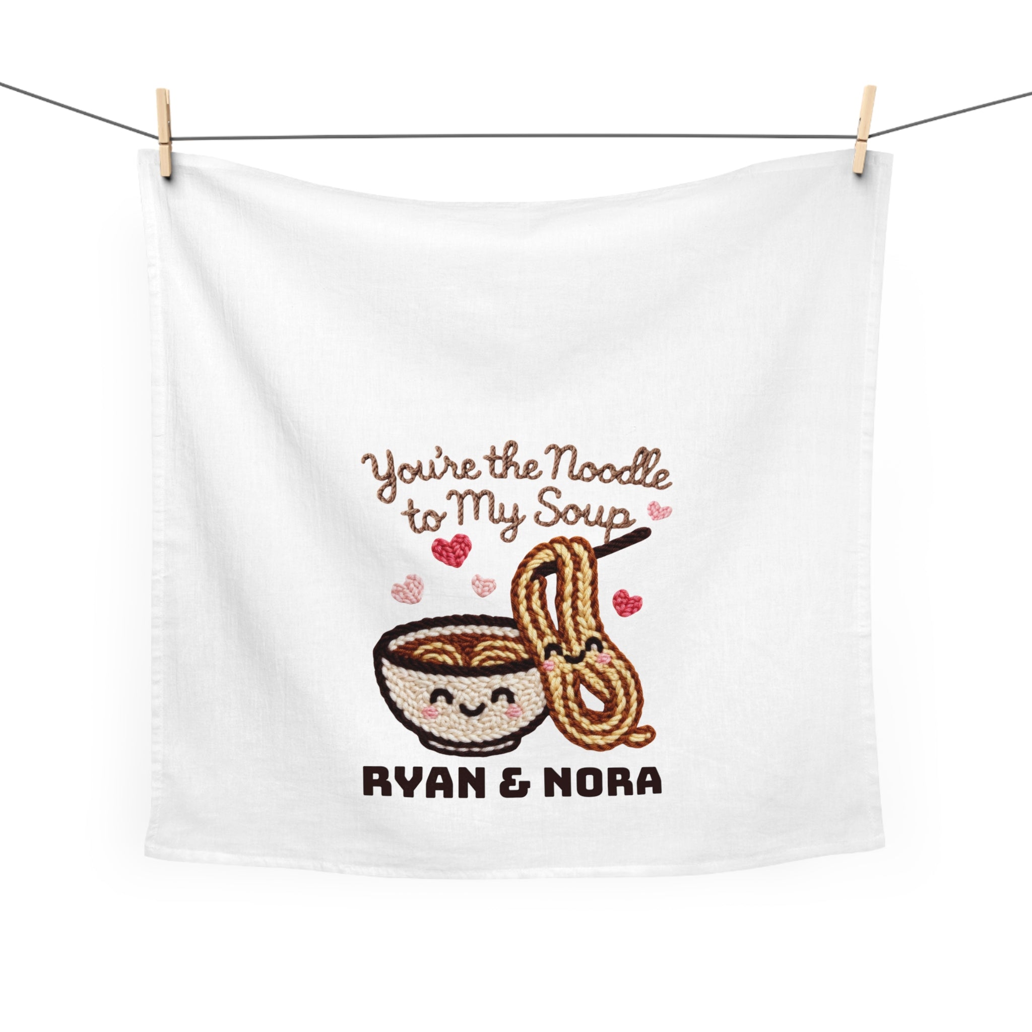Extra Large white tea towel with 'You're the Noodle to My Soup' design and text, hanging on a line.