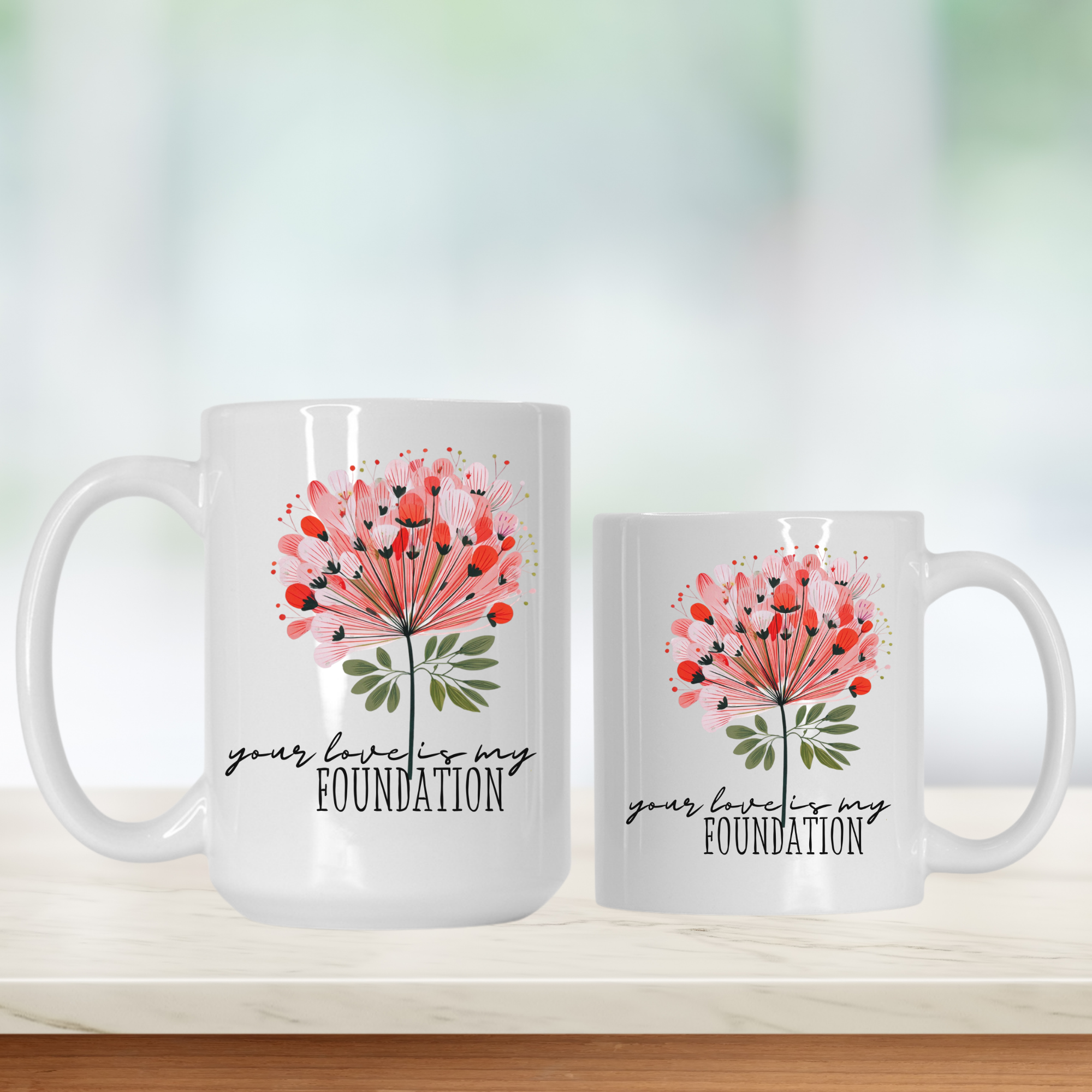 15oz and 11oz white ceramic mugs with floral design and text 'your love is my FOUNDATION' on a light background