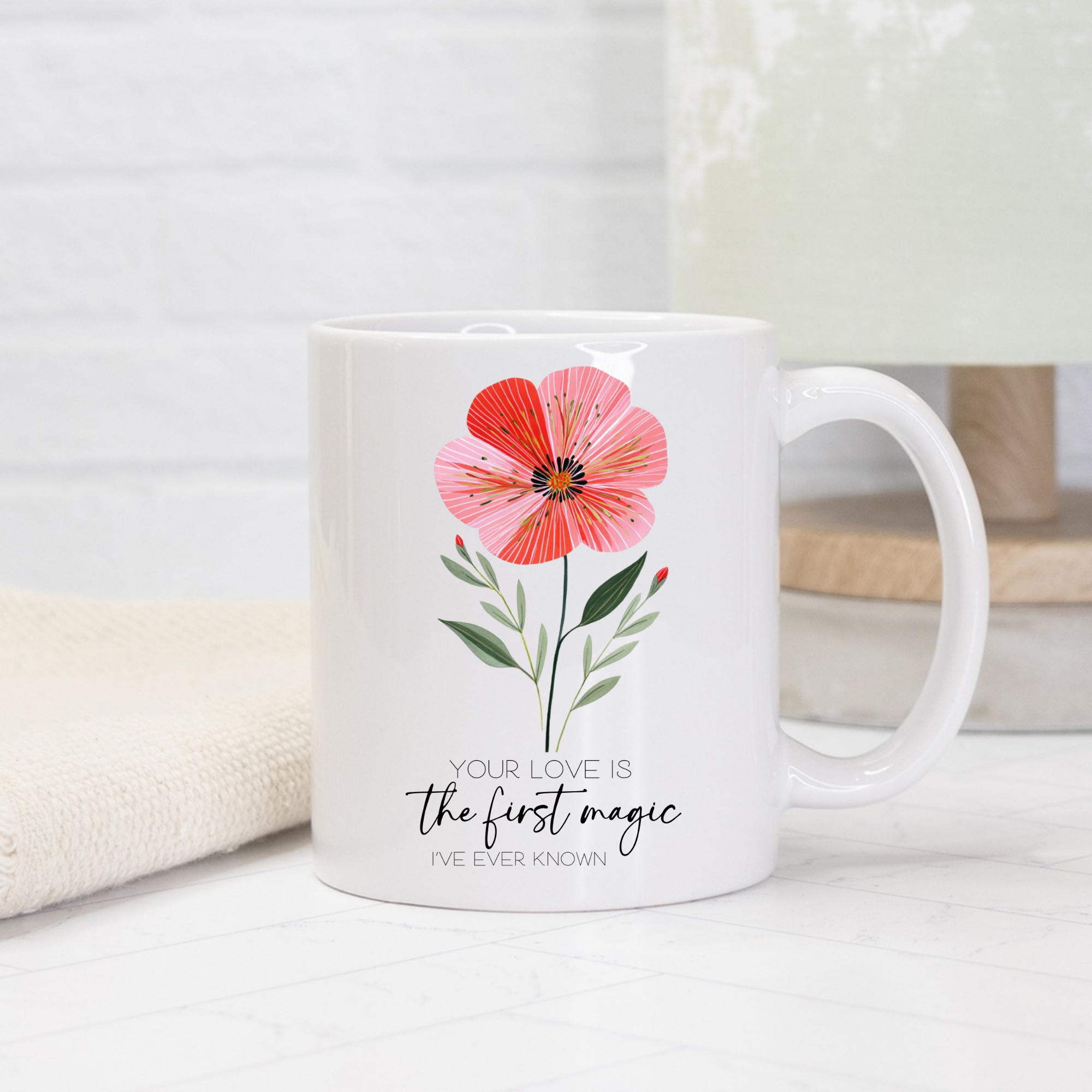 11oz white mug with a hand drawn pink flower design and text on a light background