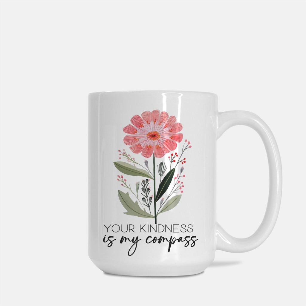White 15oz mug with floral design and text 'Your kindness is my compass' on a white background