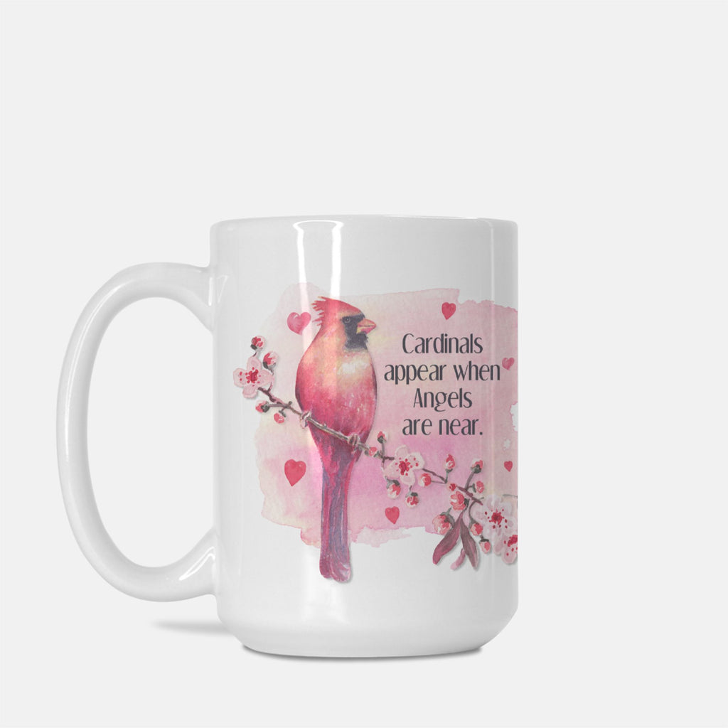White mug with a pink cardinal bird design and text on a white background