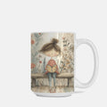 Mug with a design of a girl reading a book on a bench, surrounded by flowers.