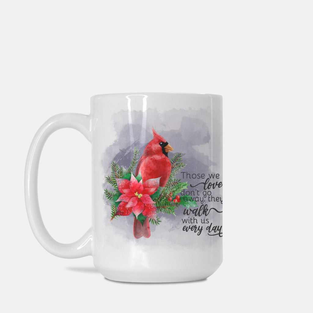 Mug with a red cardinal and floral design on a white background