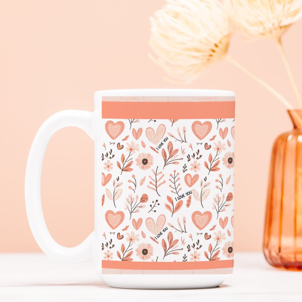 White mug with floral and heart pattern on a peach background