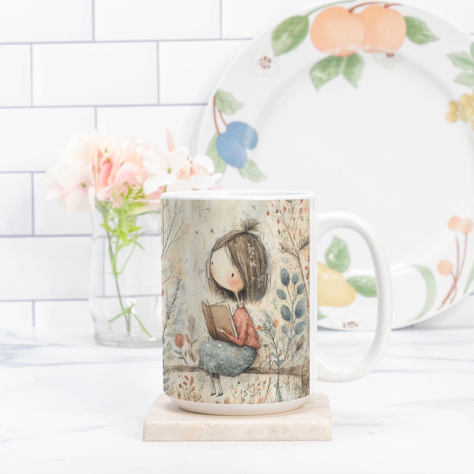 Mug with a design of a girl reading a book, placed on a white surface with a blurred background.