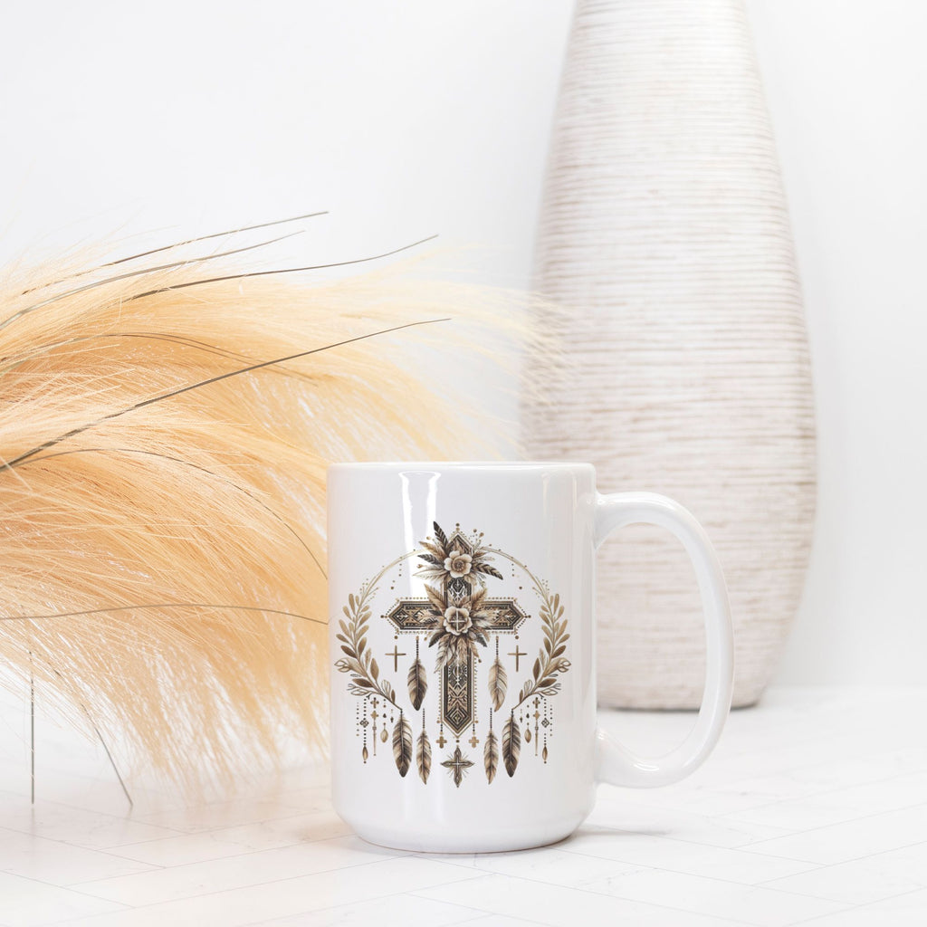 White mug with decorative cross and feather design on a light background
