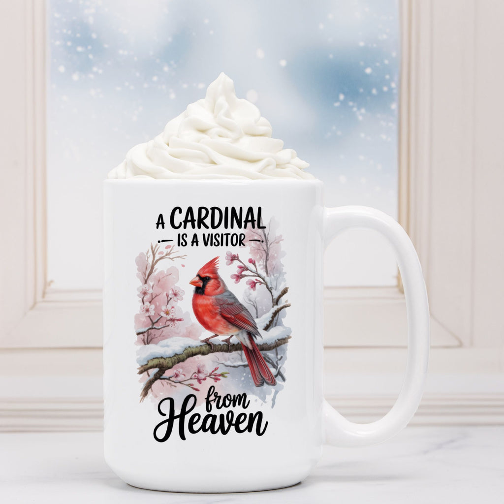 White mug with a cardinal design and text on a snowy background