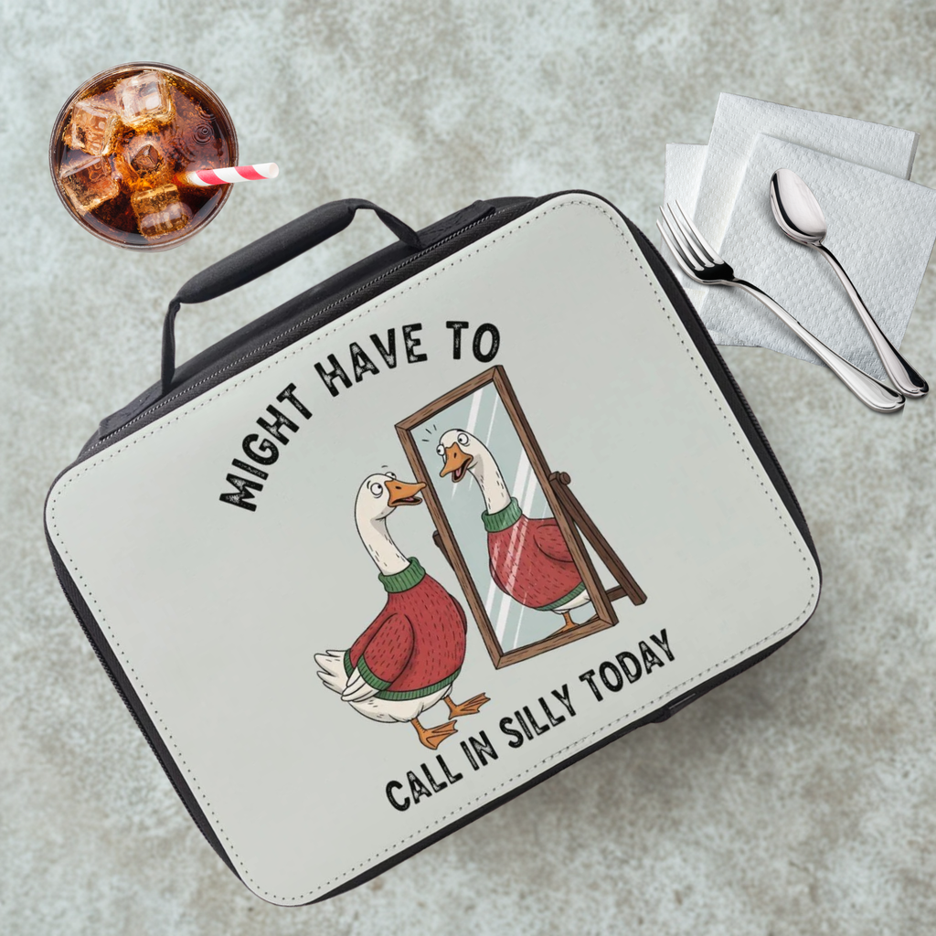 Lunch bag with a goose illustration and text on a cafeteria table with a drink and utensils.
