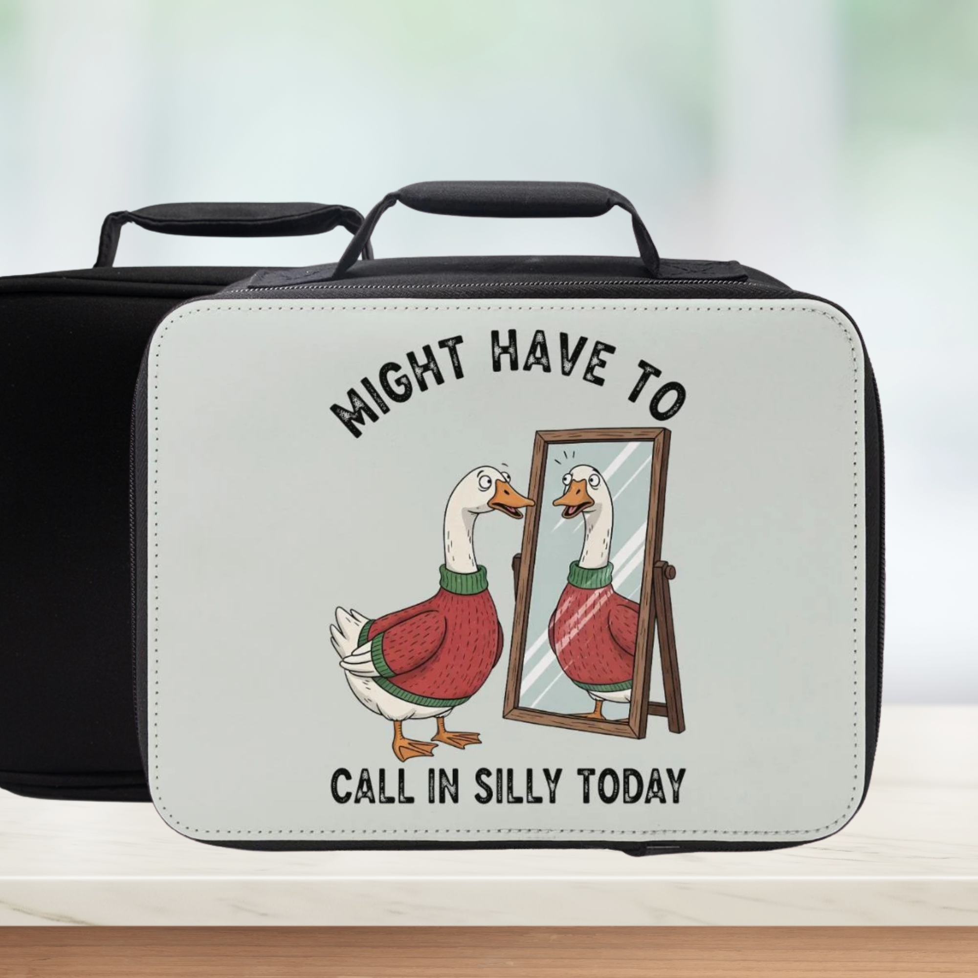 Lunch bag with cartoon goose and humorous text on a white background