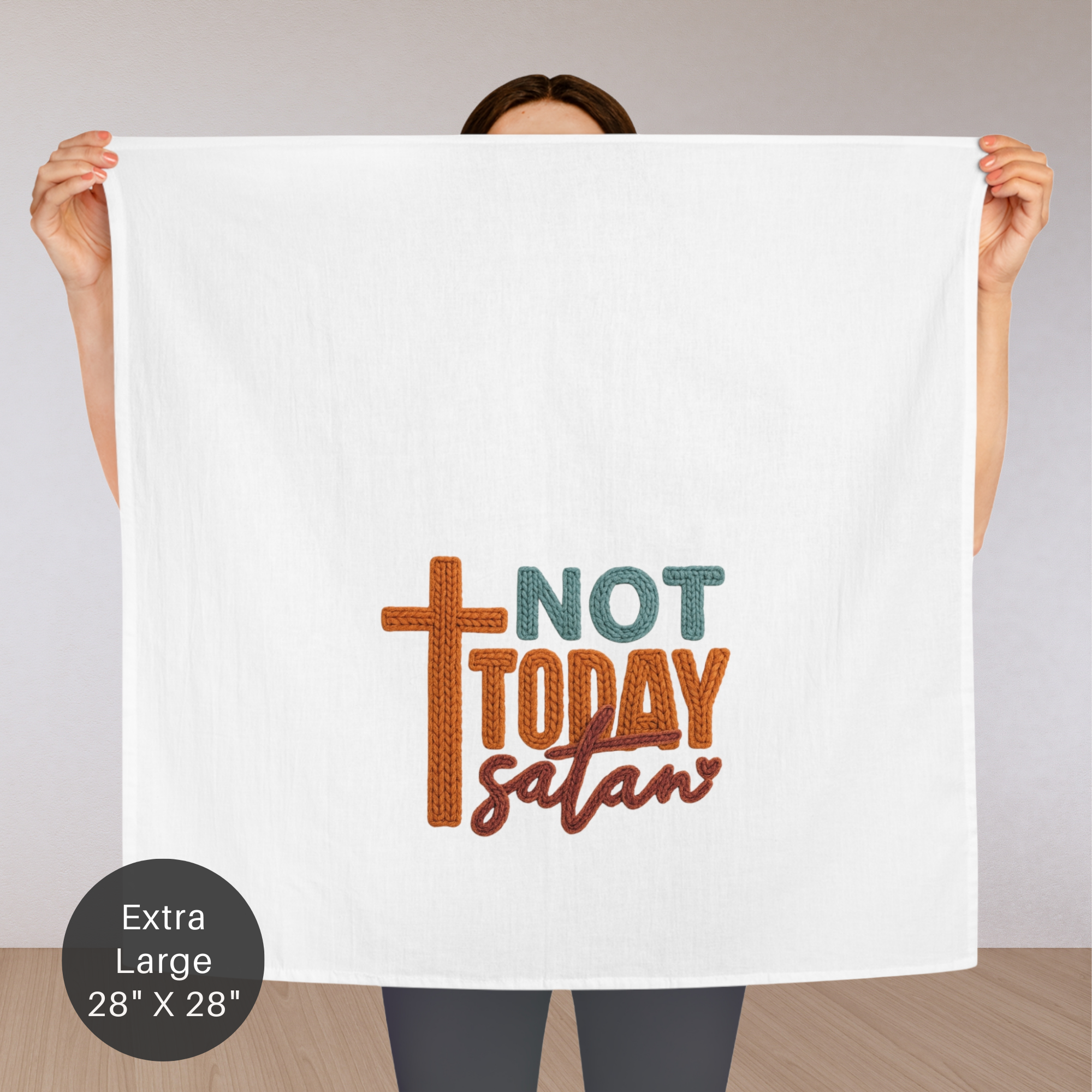 Person holding an extra large tea towel with 'Not Today Satan' text and cross graphic.