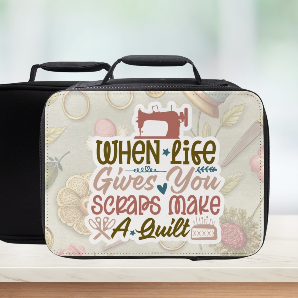 Black lunch bag with decorative cover featuring a sewing machine and text 'When Life Gives You Scraps Make A Quilt' on a light background
