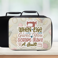 Black lunch bag with decorative cover featuring a sewing machine and text 'When Life Gives You Scraps Make A Quilt' on a light background